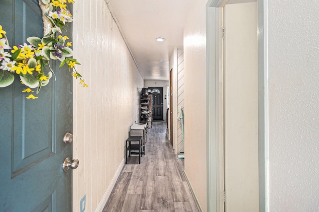 corridor featuring hardwood / wood-style floors