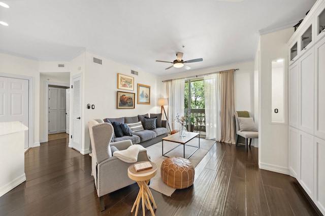 living room with ceiling fan, dark hardwood / wood-style flooring, and crown molding