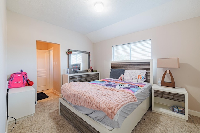 carpeted bedroom featuring vaulted ceiling