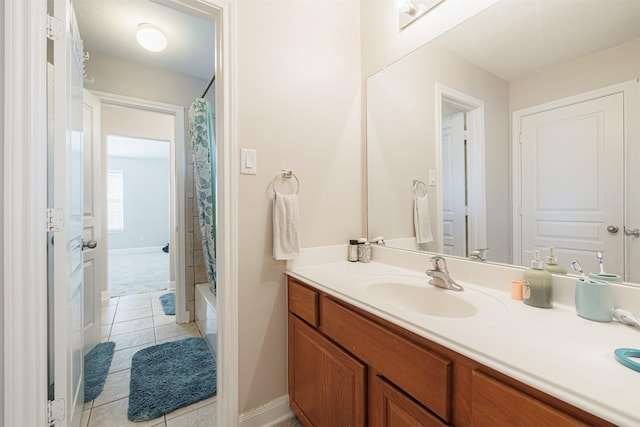 bathroom featuring tile patterned floors, shower / bathtub combination with curtain, and vanity