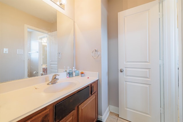 bathroom with tile patterned floors and vanity