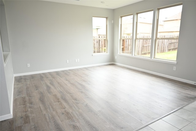 spare room with light hardwood / wood-style flooring