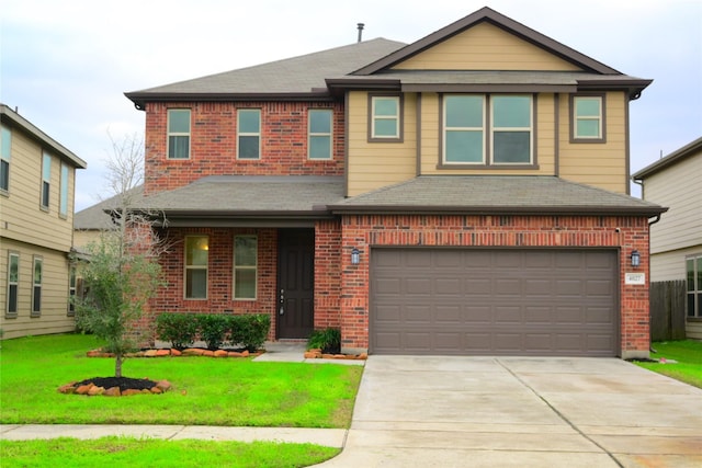 view of front of house with a front yard and a garage