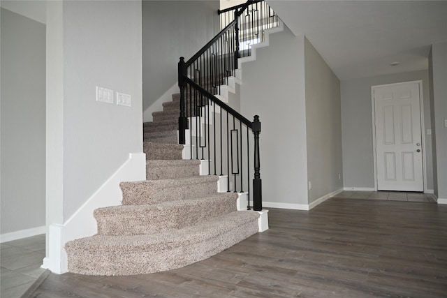 stairway with hardwood / wood-style flooring