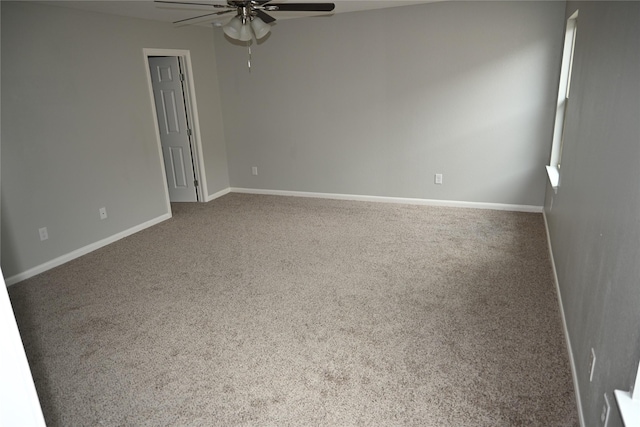 carpeted empty room featuring ceiling fan