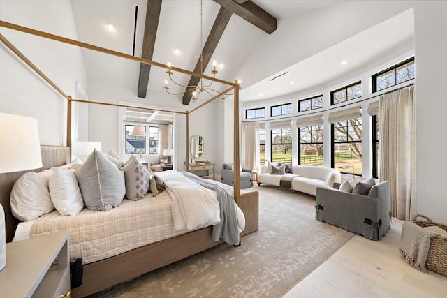 bedroom featuring a notable chandelier, light wood-type flooring, high vaulted ceiling, and beamed ceiling