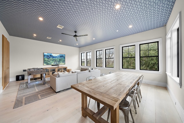 dining room featuring light wood-type flooring and ceiling fan