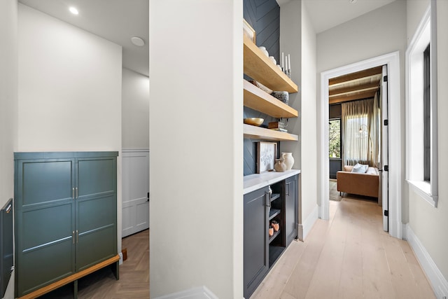 hallway with light hardwood / wood-style flooring