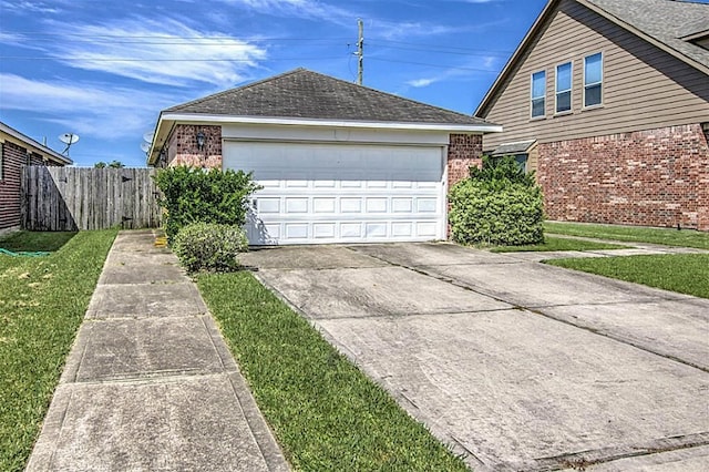 view of home's exterior with a garage and a lawn