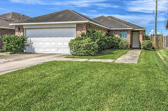 ranch-style home featuring a front yard and a garage