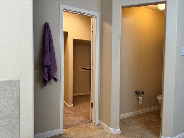 bathroom featuring tile patterned flooring and toilet