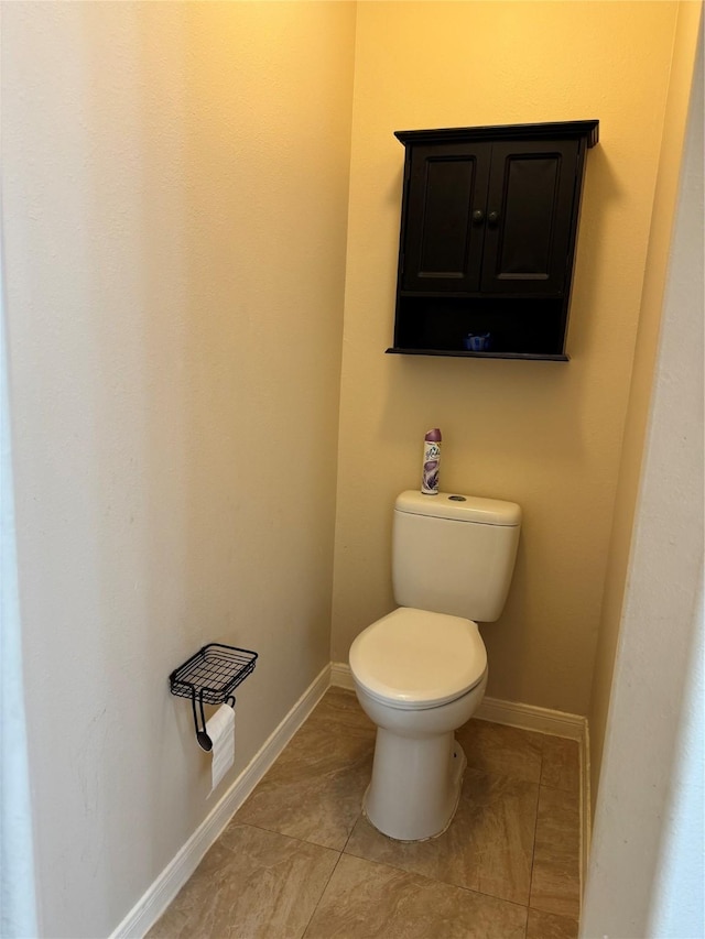 bathroom featuring tile patterned flooring and toilet