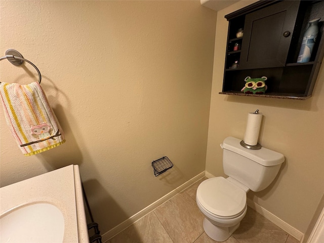 bathroom with tile patterned flooring and toilet