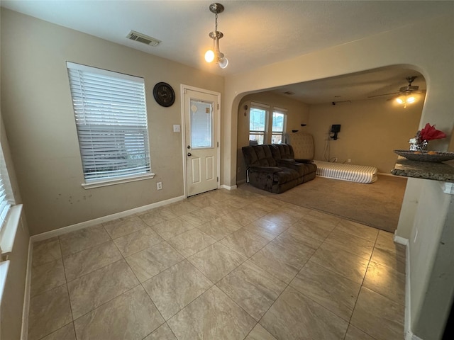 foyer featuring ceiling fan