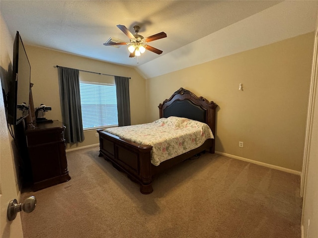 carpeted bedroom with ceiling fan and vaulted ceiling