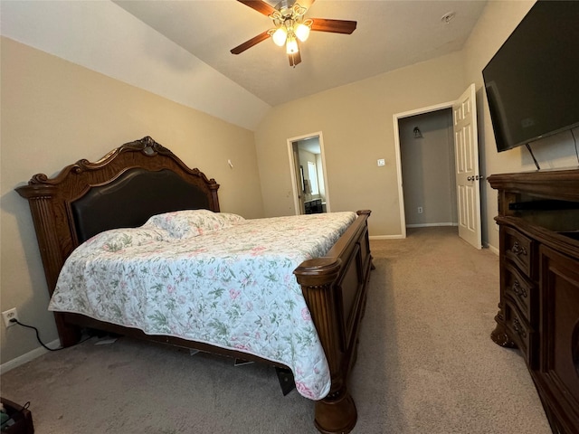 carpeted bedroom with vaulted ceiling and ceiling fan