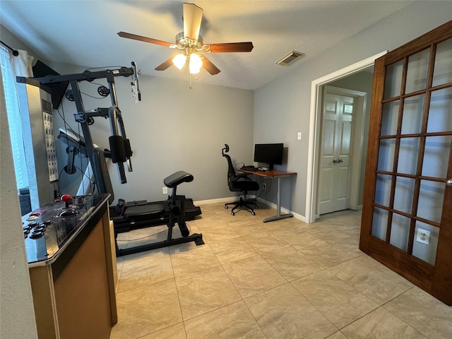 workout room with french doors and ceiling fan