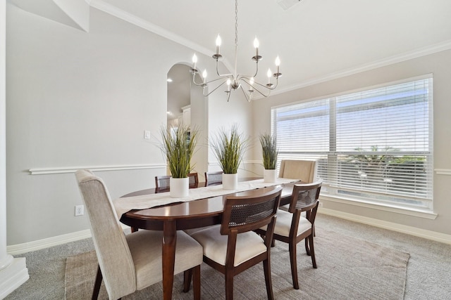 carpeted dining area featuring ornamental molding and a notable chandelier