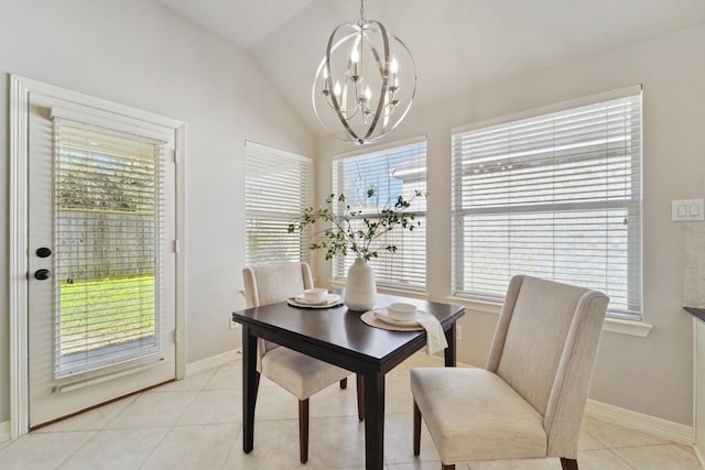 dining space with vaulted ceiling, light tile patterned flooring, and a chandelier