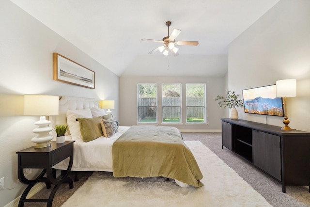 bedroom featuring vaulted ceiling, ceiling fan, and light carpet