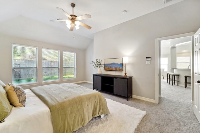 carpeted bedroom with lofted ceiling and ceiling fan