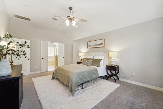 carpeted bedroom featuring lofted ceiling, ensuite bathroom, and ceiling fan