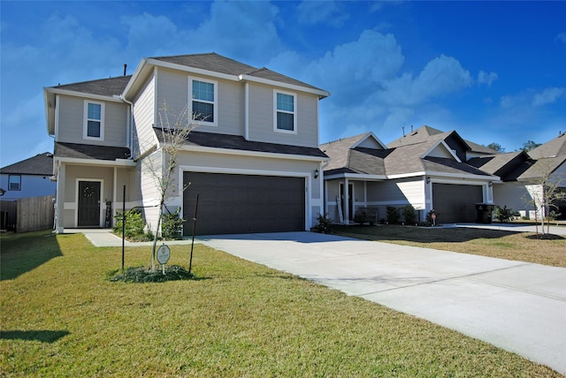 view of front of home featuring a garage and a front lawn