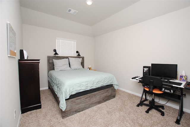 carpeted bedroom with vaulted ceiling