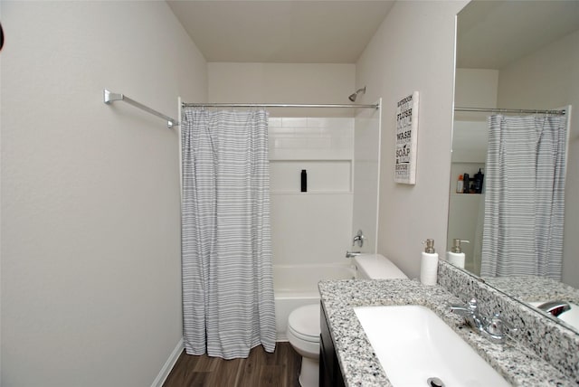 full bathroom with hardwood / wood-style flooring, vanity, toilet, and shower / bath combo with shower curtain