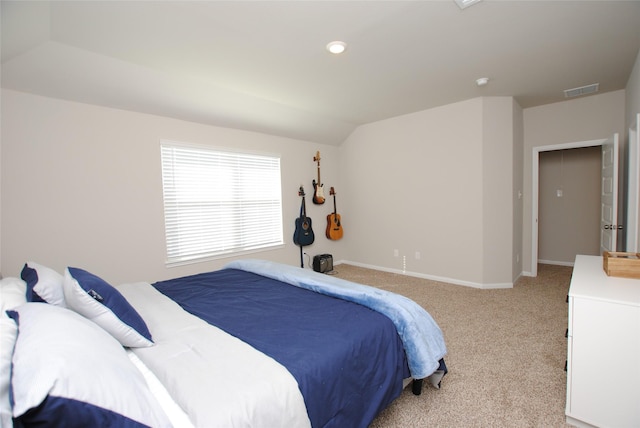 carpeted bedroom featuring vaulted ceiling