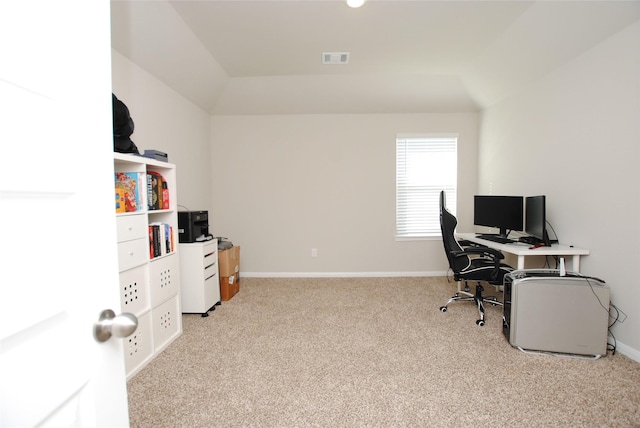 office area featuring light carpet and lofted ceiling