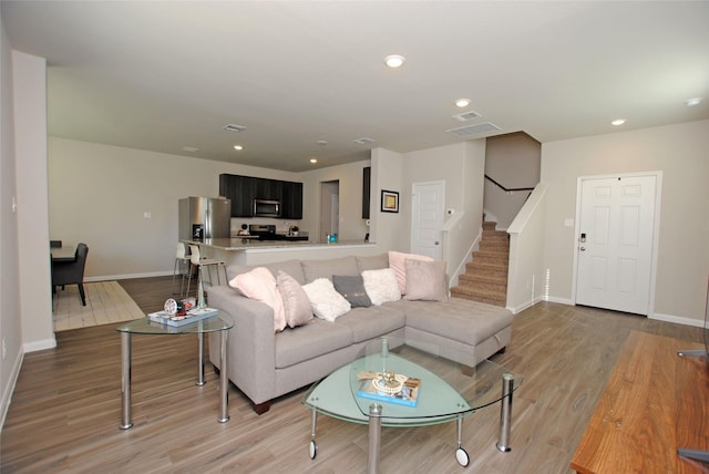 living room with light hardwood / wood-style floors