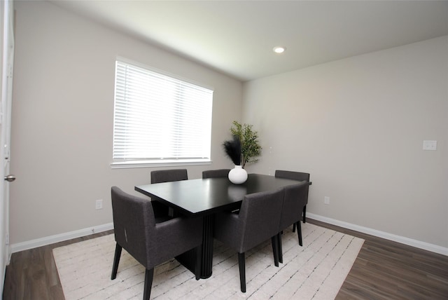 dining area with hardwood / wood-style flooring