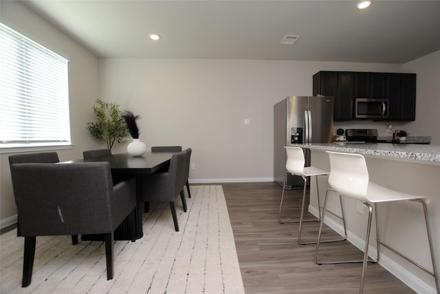 dining room featuring light wood-type flooring