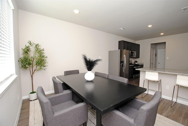 dining area featuring hardwood / wood-style flooring