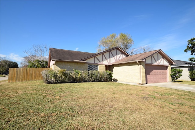 view of front of home with a garage and a front yard