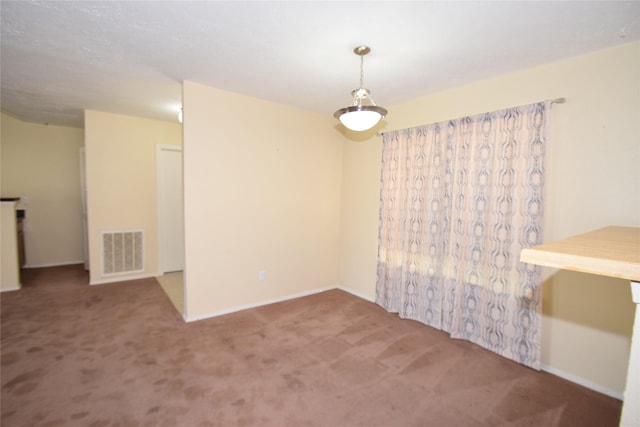 unfurnished room with carpet floors