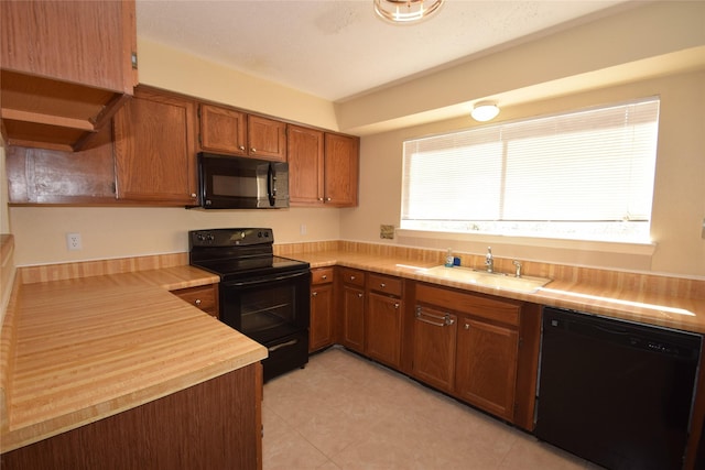 kitchen with sink and black appliances