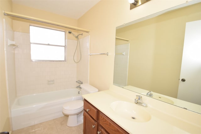 full bathroom with toilet, tiled shower / bath, tile patterned flooring, and vanity