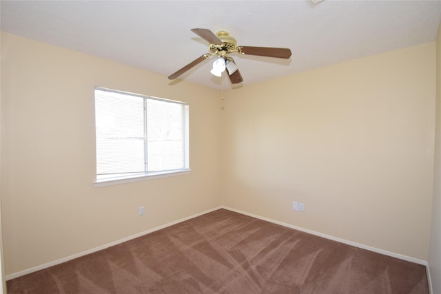 empty room featuring carpet floors and ceiling fan