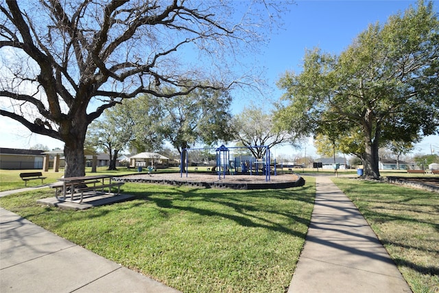 view of community with a playground and a yard