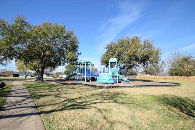 view of jungle gym featuring a lawn