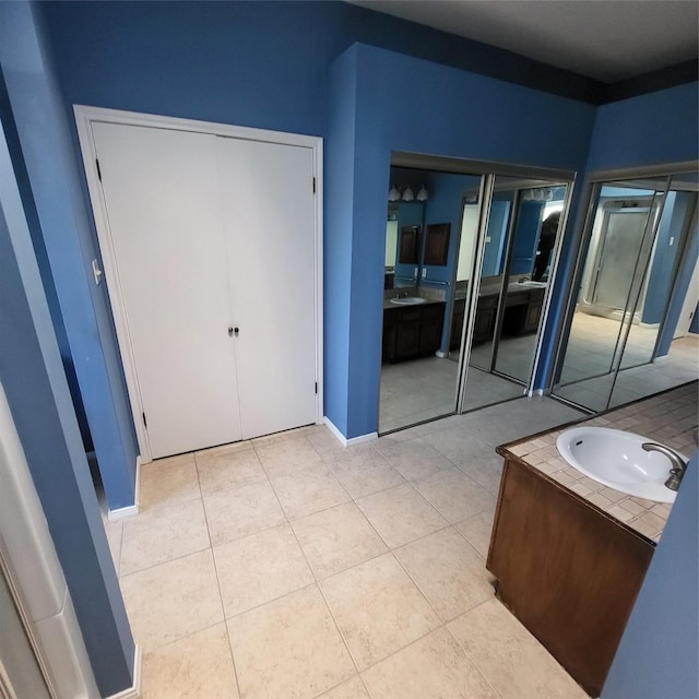 bathroom featuring tile patterned flooring and sink