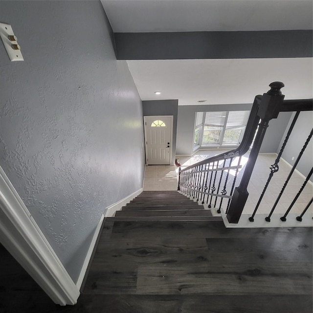 stairway featuring hardwood / wood-style flooring