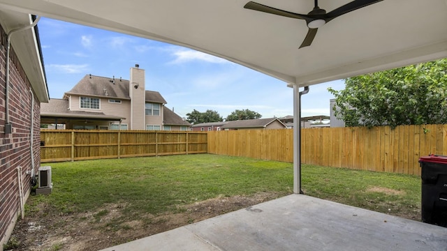 view of yard with central air condition unit, a patio area, and ceiling fan