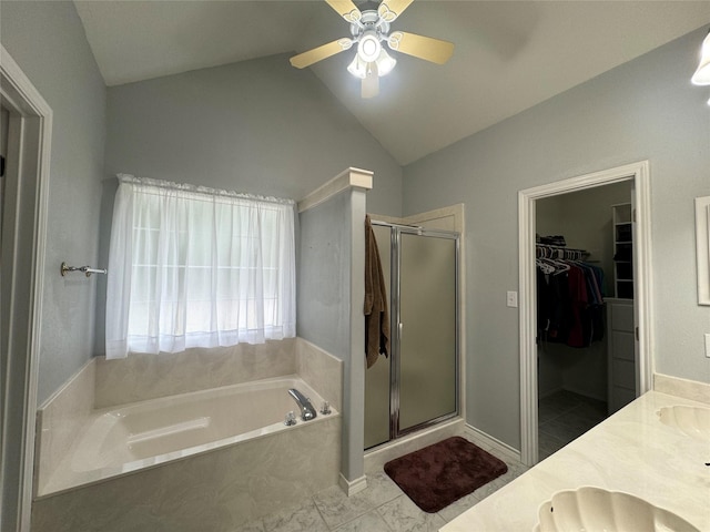 bathroom with vanity, separate shower and tub, ceiling fan, and lofted ceiling