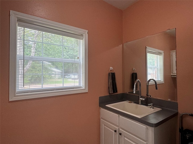 bathroom featuring a wealth of natural light and vanity