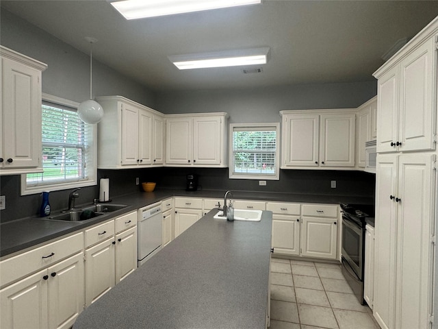 kitchen featuring white cabinets, white appliances, and sink