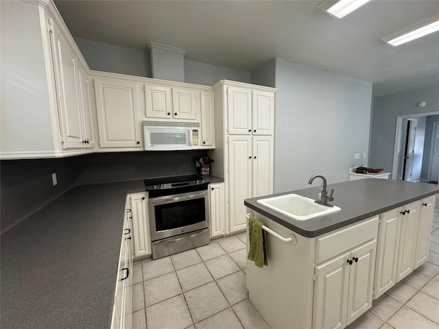 17 Cottonwood Rd, Trinity, TX 75862 - kitchen featuring stainless steel electric range oven, white microwave, a sink, dark countertops, and light tile patterned floors