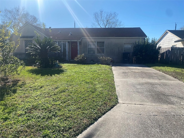 ranch-style home with a front lawn